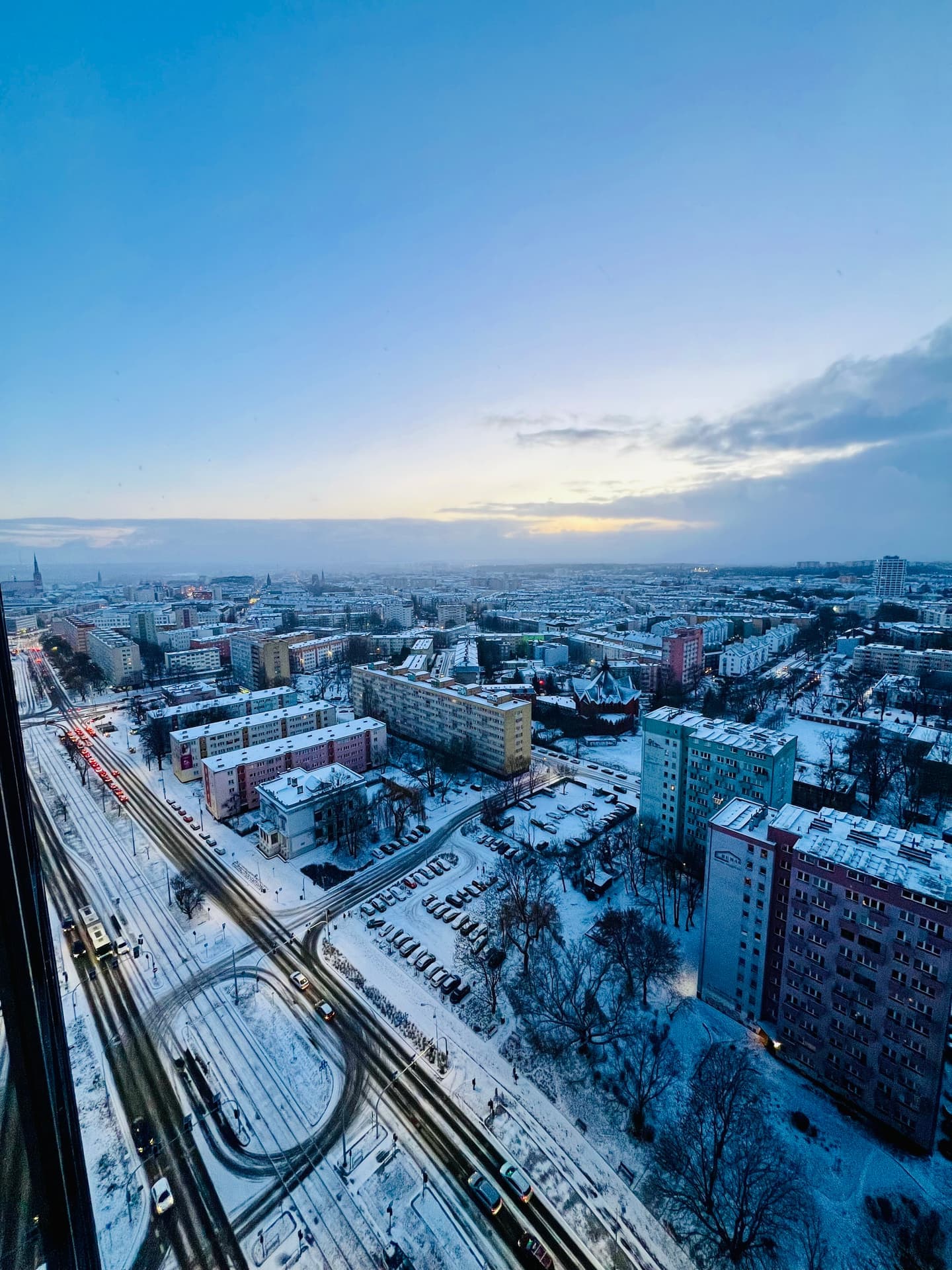 Aerial winter view over snow-covered Szczecin at dusk