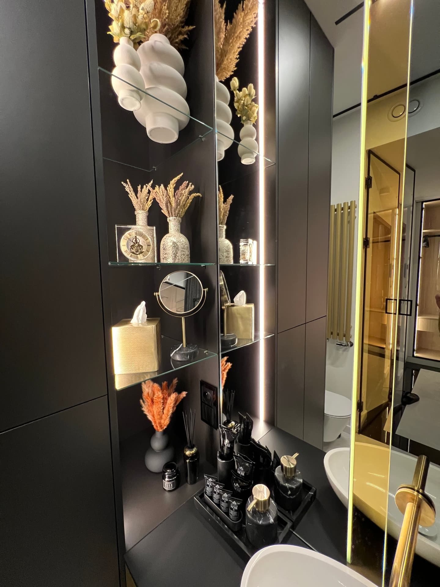 Bathroom decorative shelves with pampas grass, ceramics and luxury accessories