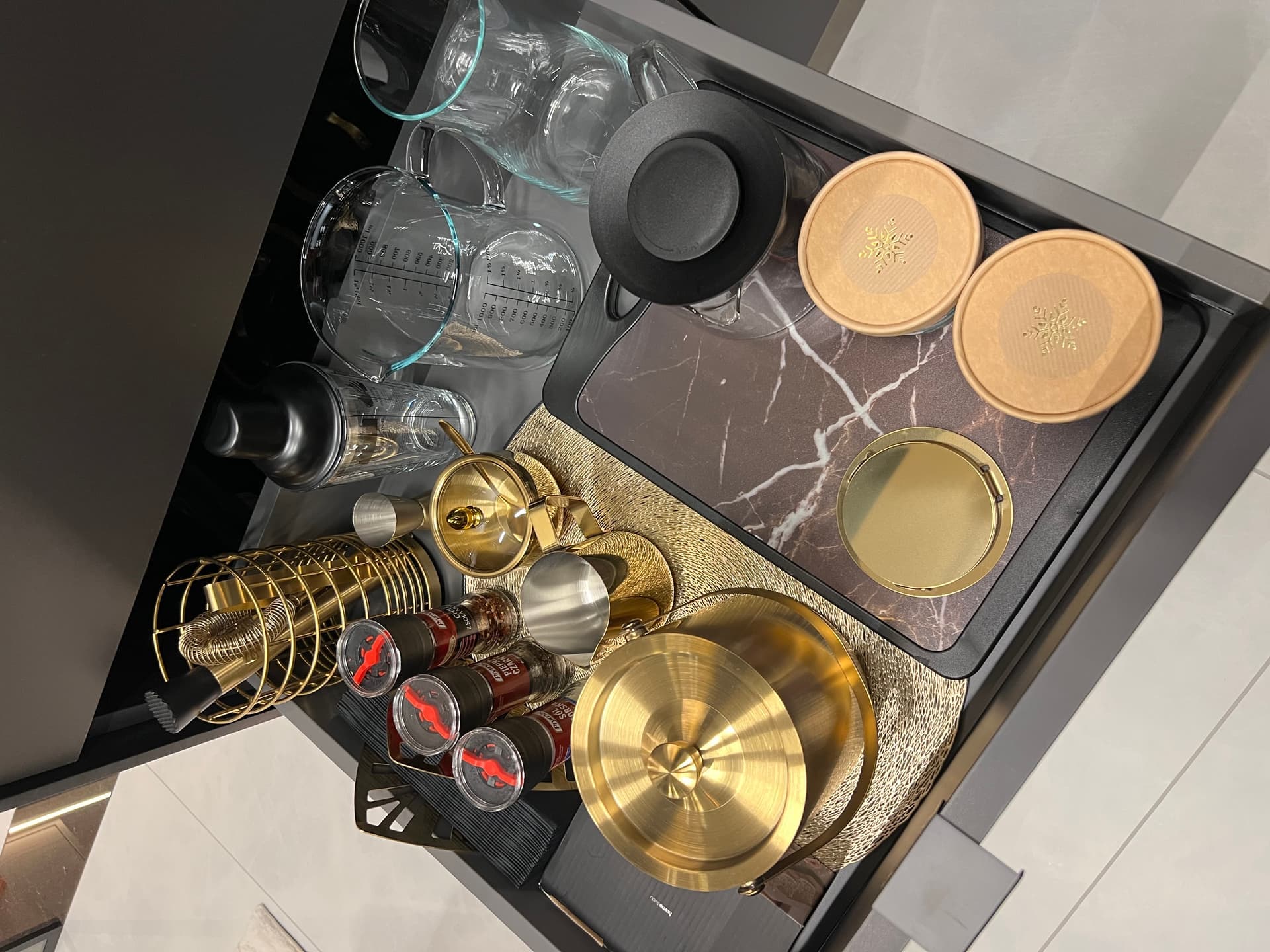 Kitchen drawer with glassware, coasters, bar kit and drinks